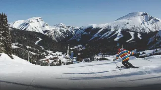downhill skier at Sunshine Village ski resort 