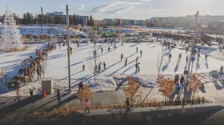 people outdoor ice skating at Central Commons Park in University District