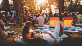 couple enjoying the Calgary Folk Music Festival in Prince's Island Park