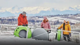 a group of friends tubing at Winsport Calgary