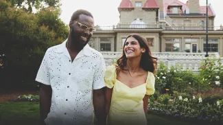 couple smiling in front of the Lougheed House