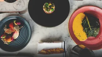 Table with dishes of food at The Wilde on 27