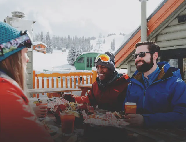 skiers enjoying lunch outside at Sunshine Village ski resort