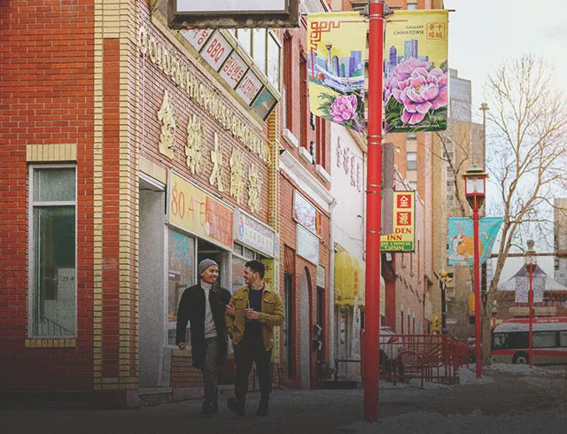 Couple walking through Calgary's Chinatown