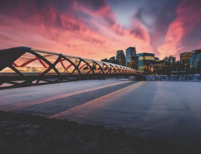 peace bridge over the bow river during winter