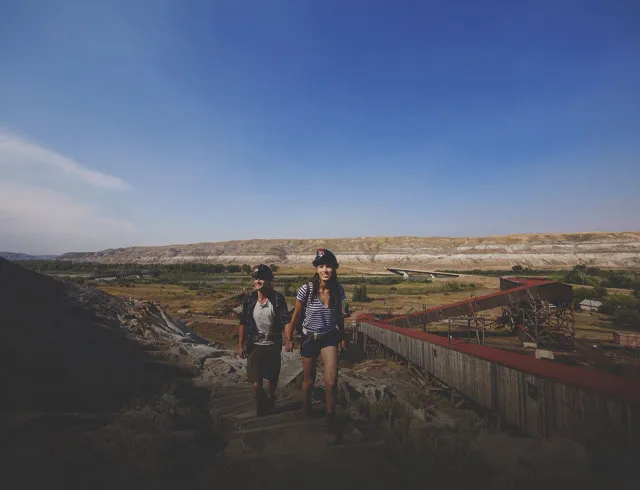 couple walking through the Badlands of Drumheller in Alberta