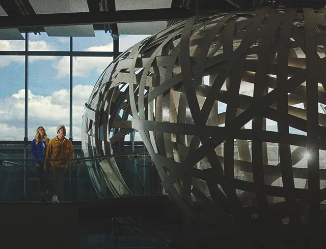 couple exploring an art exhibit at Esker Foundation