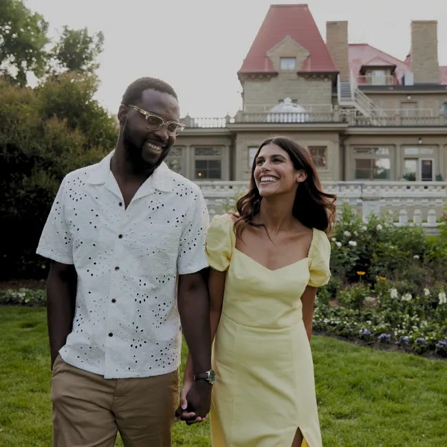 couple smiling in front of Lougheed House