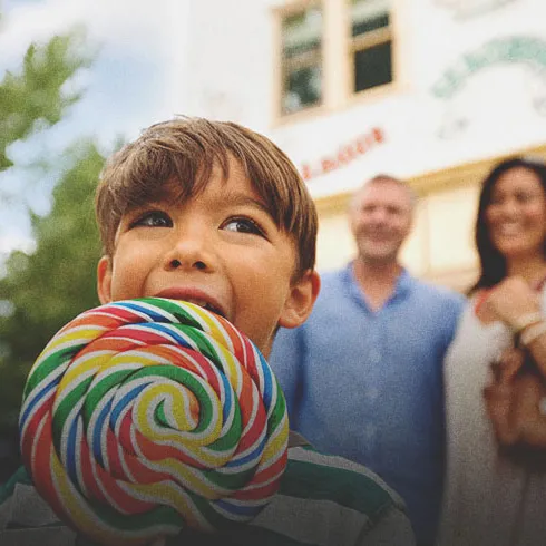 Young boy with a lollipop at one of Calgary's Top Attractions