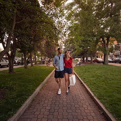 couple waling through a park