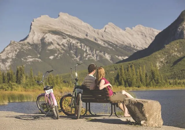 Couple biking in Banff