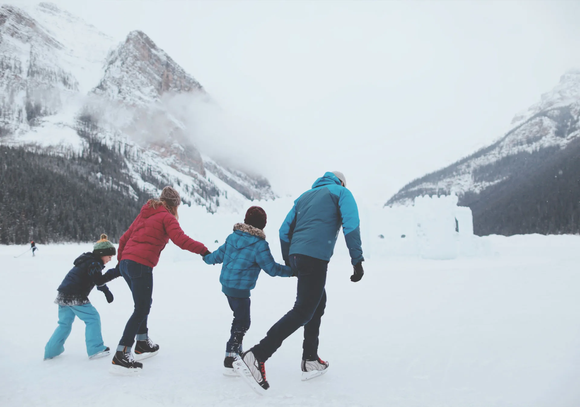 Family skating on a frozen lake 