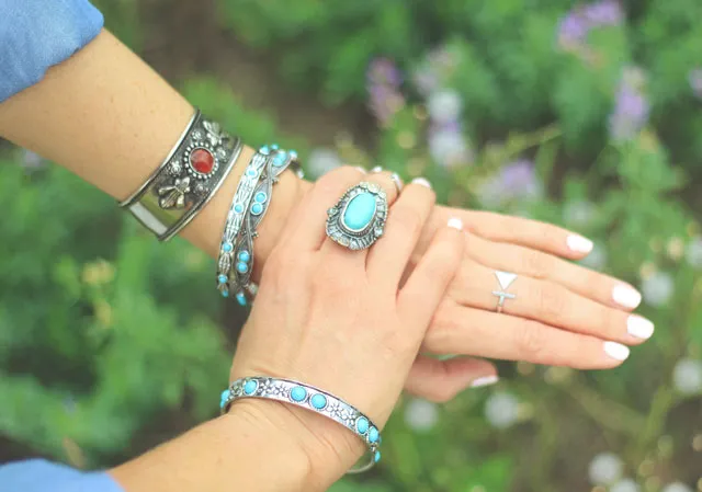 Cuff bracelets and vintage turquoise rings make for great Stampede style.