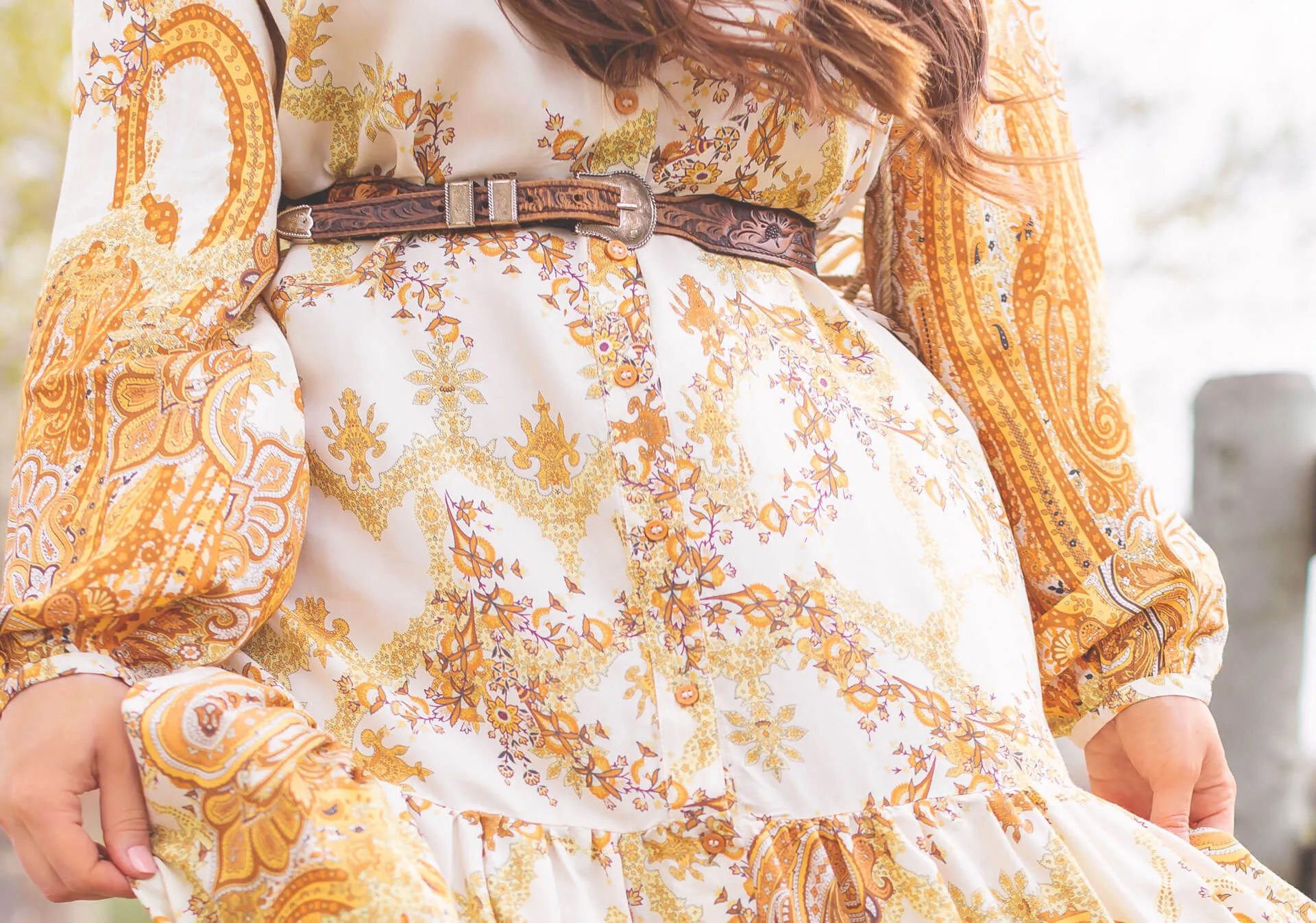 A belt is a great complement to your flowy dress