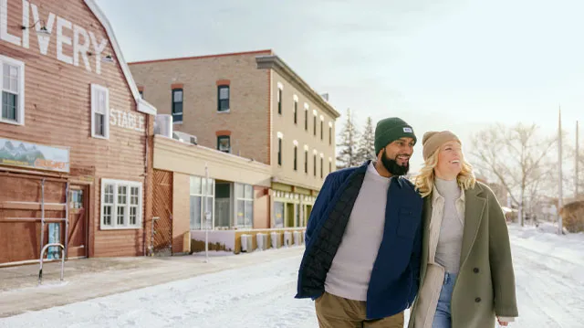 Couple walking through Inglewood in the winter