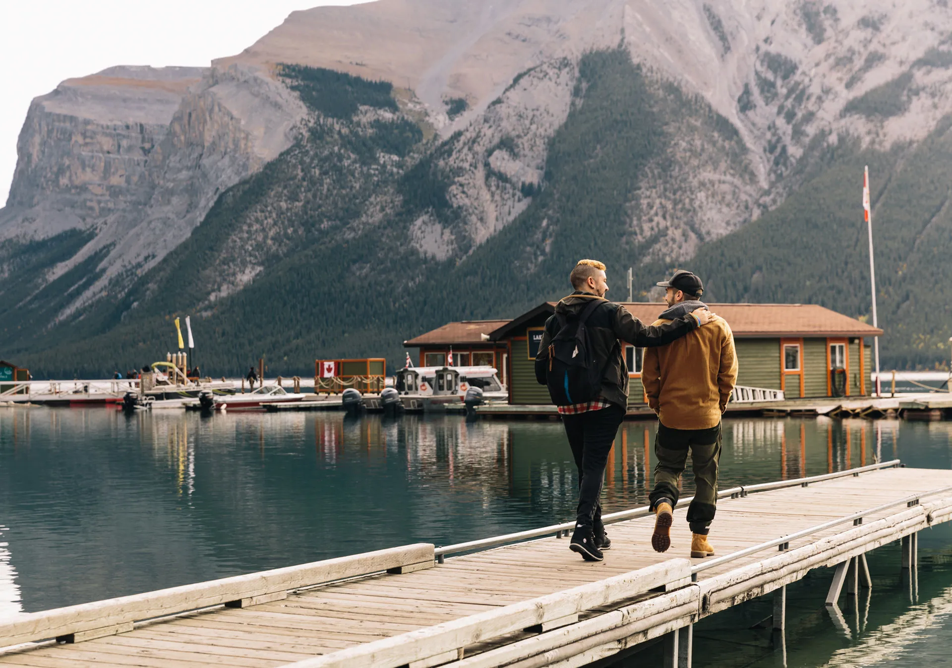 People walking onto the dock at Lake Minnewanka Cruise