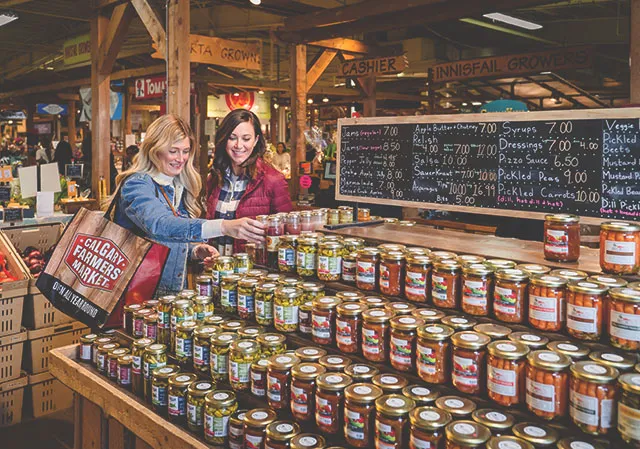 Two women shopping  at the Calgary Farmers' Market