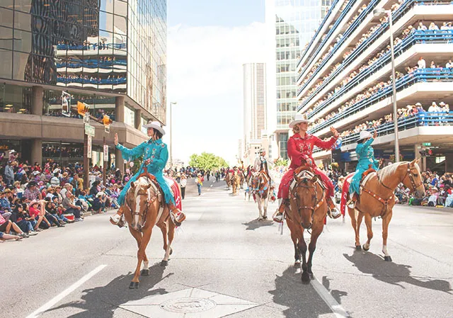 Rodeo Queens riding horses in The Calgary Stampede Parade