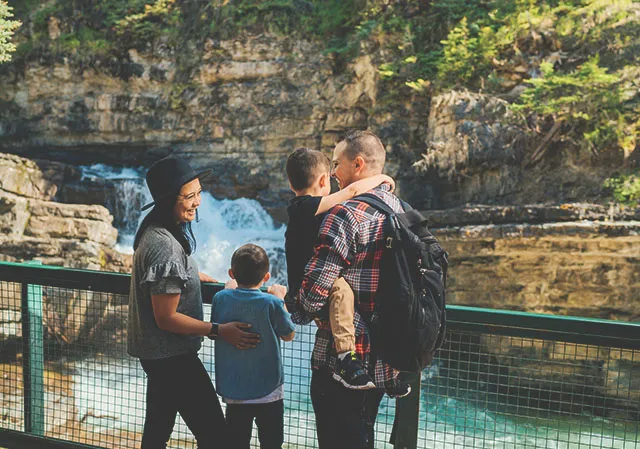 Family of four exploring Johnston Canyon in Banff National Park
