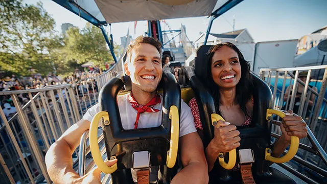 Couple on a roller coaster ride at the Calgary Stampede