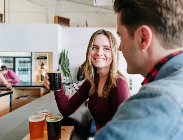 Couple sampling beer flights at Annex Ales