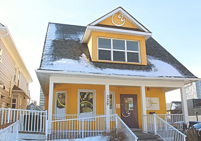 exterior of Yann Haute Patisserie, a yellow heritage house