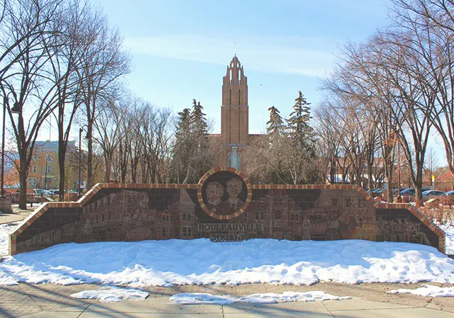 Rouleauville Square brick signage in front of church