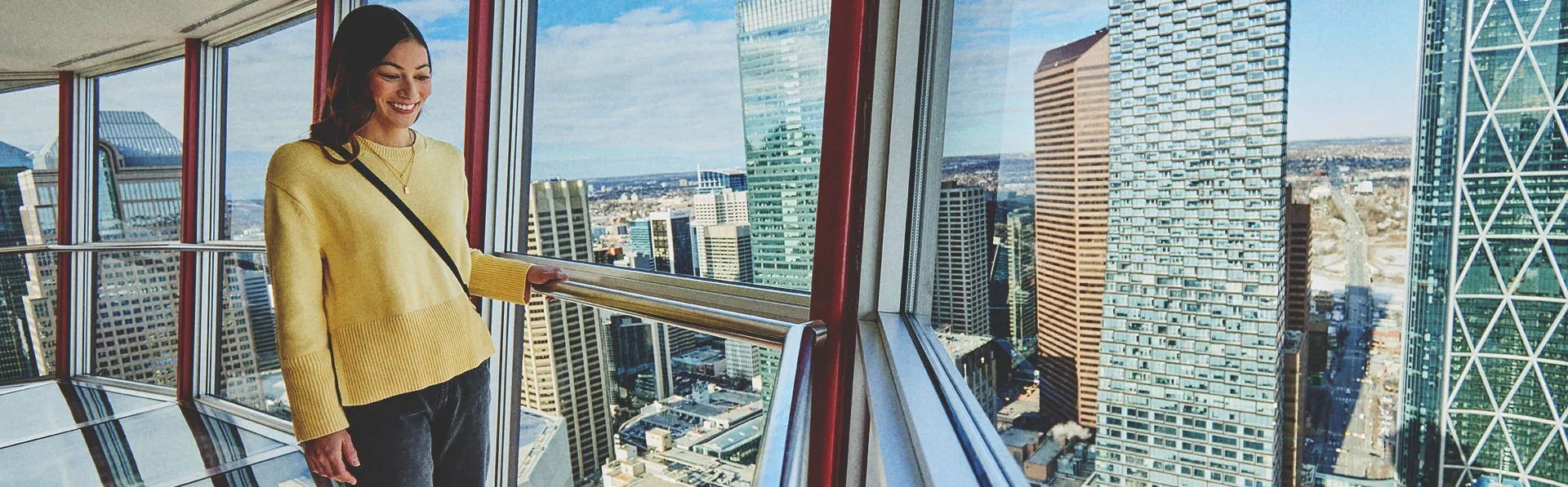 Woman walking on the Calgary Tower's glass floor