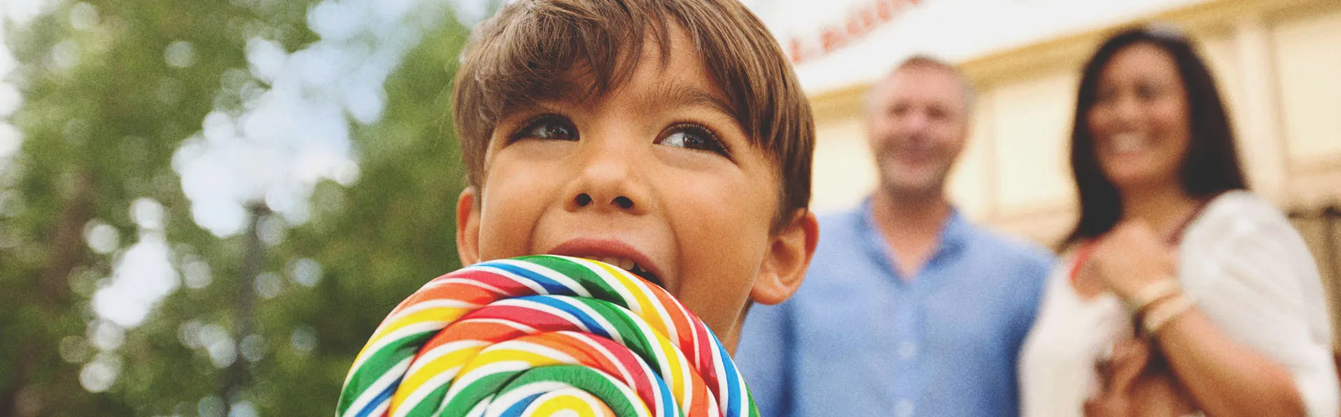 Young boy with a lollipop at one of Calgary's Top Attractions