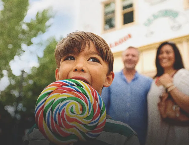 Young boy with a lollipop at one of Calgary's Top Attractions