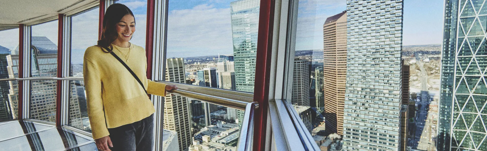 Woman looking out from the Calgary Tower 