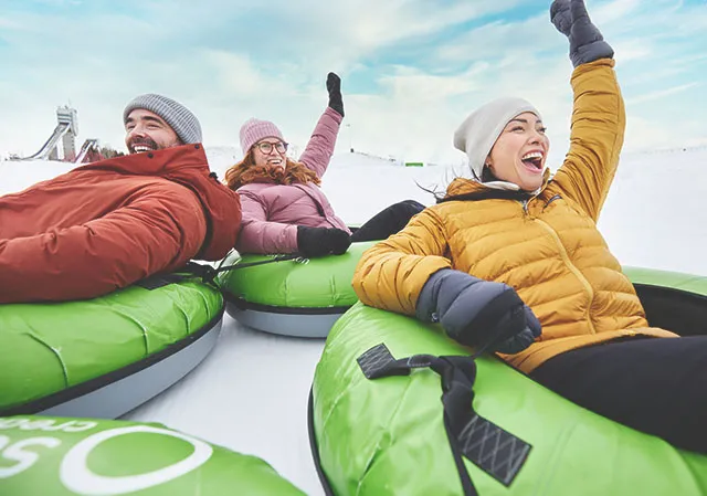 3 friends Snow Tubing at WinSport