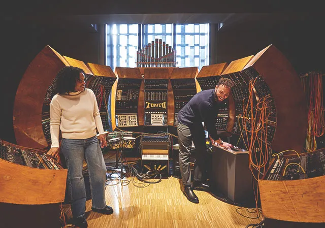 couple exploring TONTO at Studio Bell, home of the National Music Centre