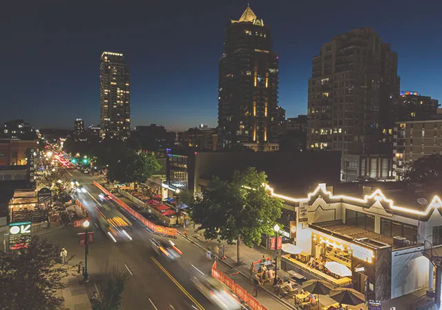 aerial view of Calgary's 17th Avenue bars and restaurants bustling after dark