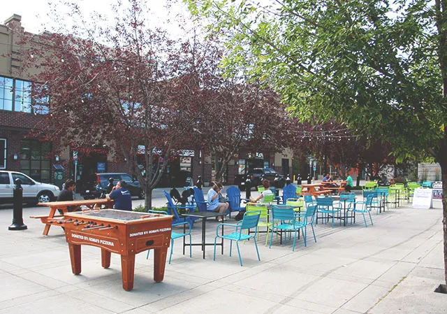 La Piazza in Bridgeland with tables, chairs, and an outdoor foosball table
