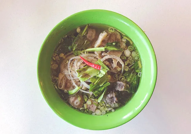 Pho in a green bowl at Pho Dau Bo