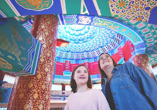 mother and daughter admire the intricate patterns on the roof of the Chinese Cultural Centre in Calgary