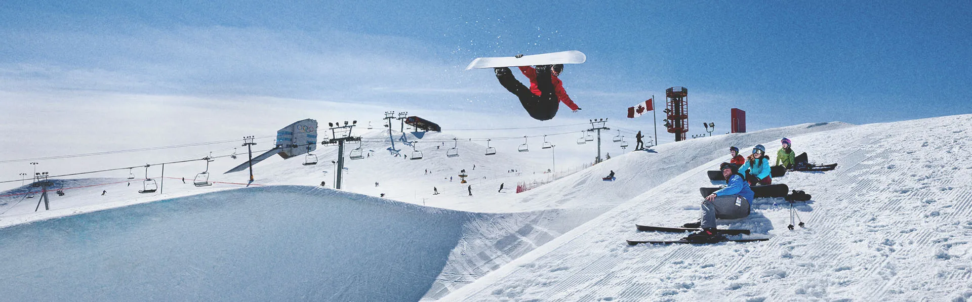 snowboarder jumping at WinSport ski hill in Calgary