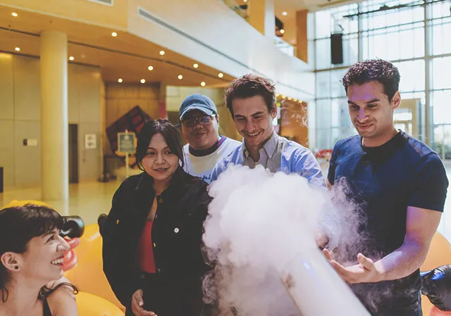 group of friends experiencing science experiments at TELUS Spark