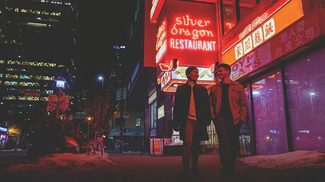 couple walking through Calgary's Chinatown