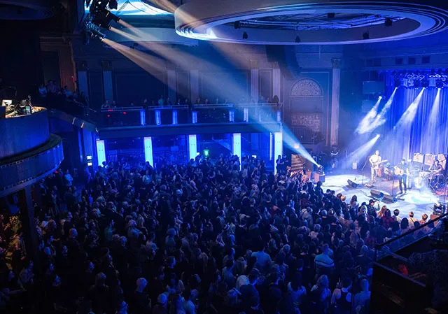 crowd enjoying a show at The Palace Theatre