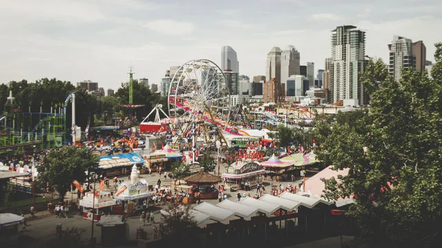 Midway at the Calgary Stampede grounds with the skyline in the background