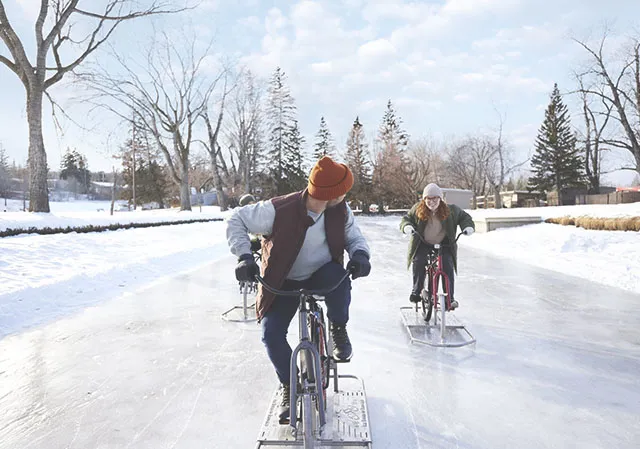 group of friends ice biking on Bowness Lagoon