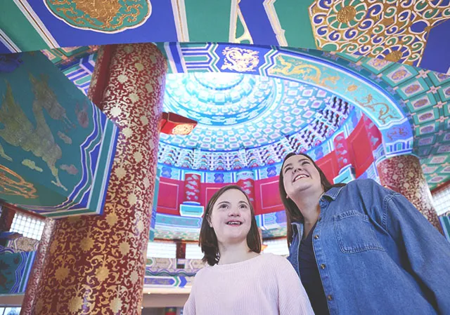 mother and daughter admire the ornate ceiling of the Calgary Chinese Cultural Centre