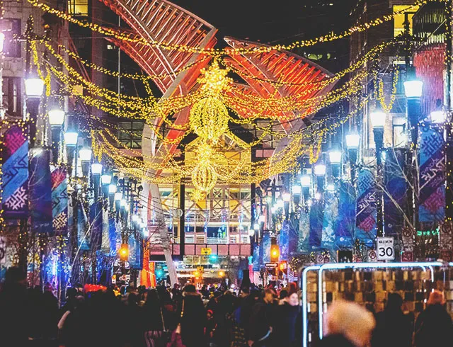 crowds enjoy light displays and art installations along Stephen Avenue during Chinook Blast