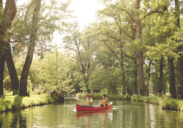 father & son canoeing in bowness lagoon