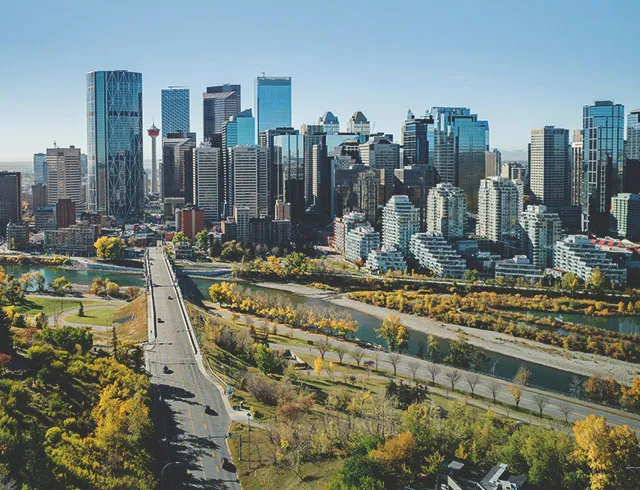 aerial of the Calgary skyline looking down Centre street during late summer
