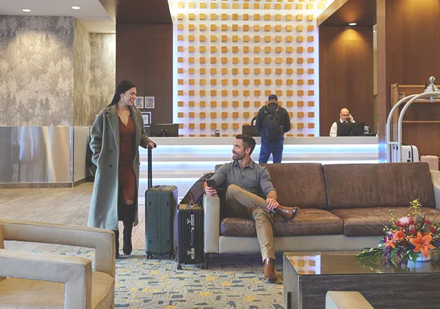 two people in the lobby on Grey Eagle Resort & Casino