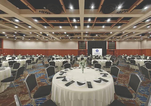 The Imperial Ballroom at Hyatt Regency Calgary set up with tables &amp; chairs for a banquet event