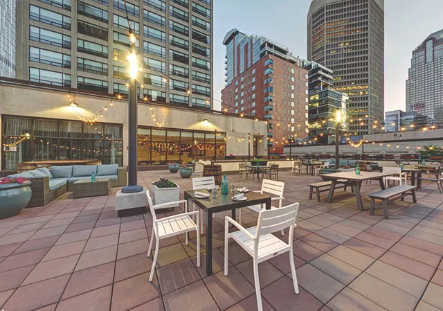 Calgary Marriott Downtown's OneUp Rooftop Patio during sunset